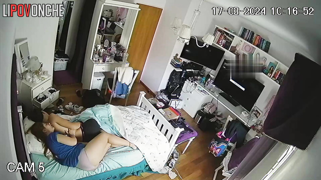The red-haired girl presses her sexy body tightly against boyfriend's back