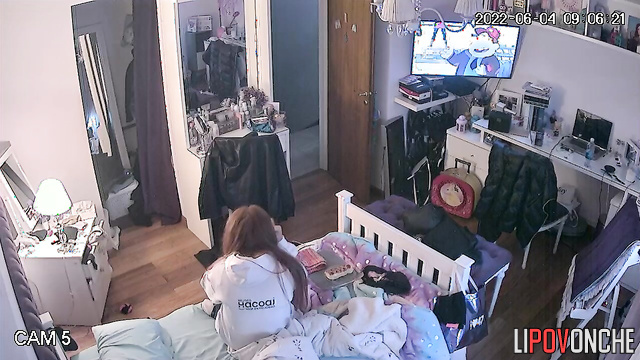 A young redheaded cutie with sexy tits doesn't like wearing a bra at all