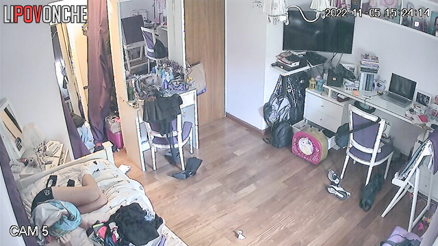 A sweet girl walks into her bedroom wearing nothing but panties