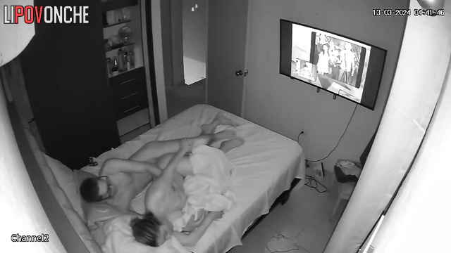 An aroused man shoves his big cock into the ass of a mommy who is watching TV