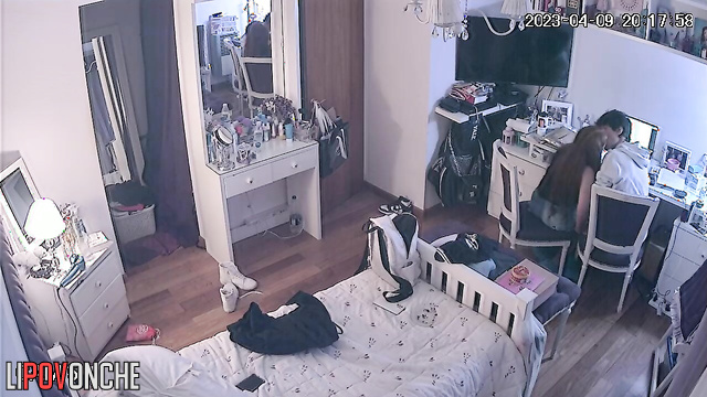 Teens enjoying each other (boy gently stroked her hair)