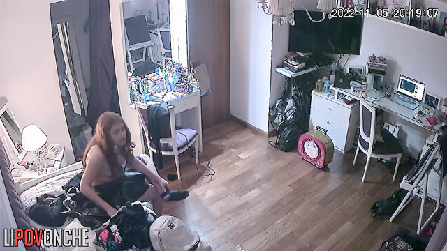 A completely naked redheaded student dances seductively in front of the mirror