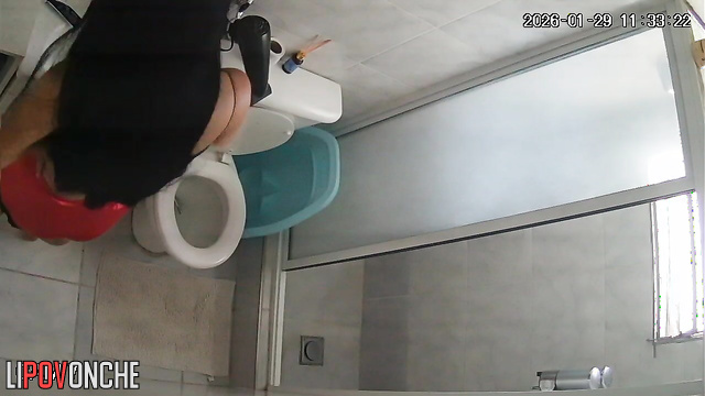 A long-haired, pregnant brunette gently wipes her labia after peeing