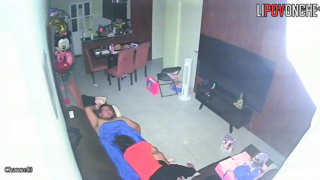 A horny mom plays with her bored husband's big cock while watching TV