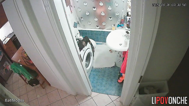 A cute girl with a seductive body strips completely naked in the bathroom