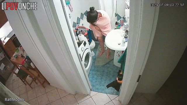 The girl seductively slips out of her sexy black nightgown before taking a shower