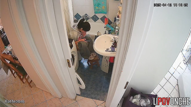 A cute brunette washes her butt, then carefully dries it and her wet pussy