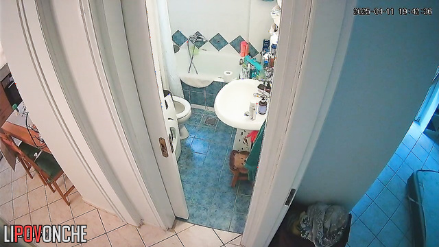 After pooping, a beautiful brunette washes her delicate, sexy ass