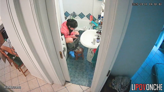 After pooping, a beautiful brunette washes her delicate, sexy ass