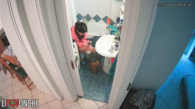 After pooping, a beautiful brunette washes her delicate, sexy ass