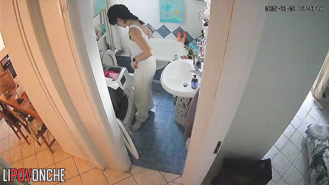 The stunning beauty takes off her white outfit, revealing her alluring tits