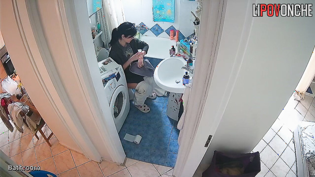 A girl with her bare ass washes her hands without getting up from the toilet