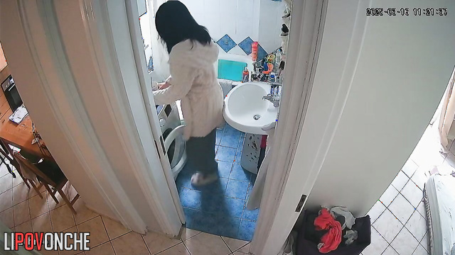 Sitting on the toilet, the housewife pulls her panties down lower and lower