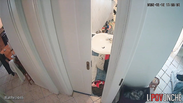 A girl with her naked ass takes off a panty liner from her half-way-down panties