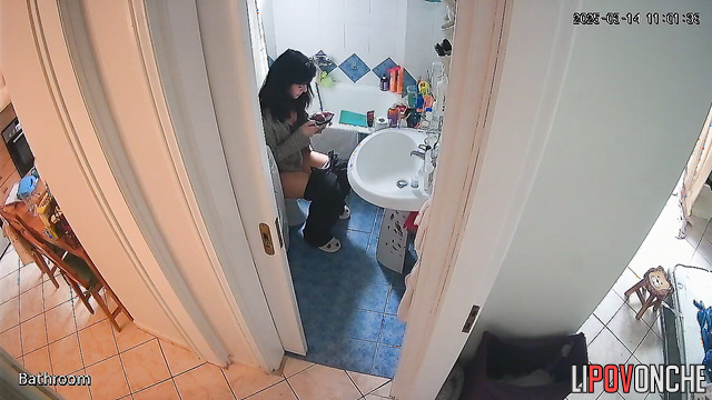 After peeing, the pretty brunette wipes her wet pussy and examines the napkin