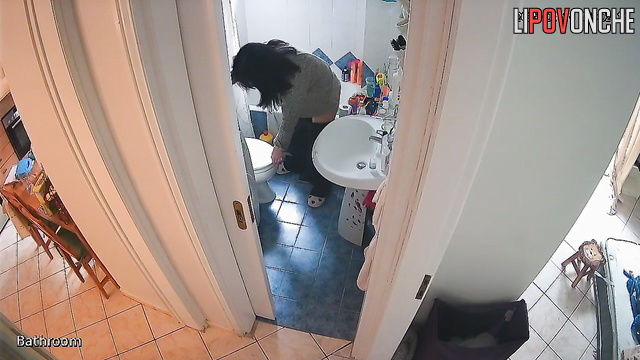 After peeing, the pretty brunette wipes her wet pussy and examines the napkin