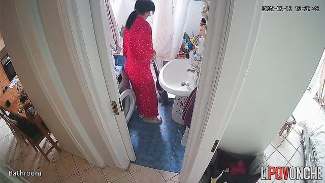 After cleaning the apartment, the girl pulls down her panties and sits down to pee