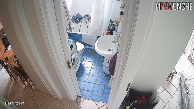 After cleaning the apartment, the girl pulls down her panties and sits down to pee