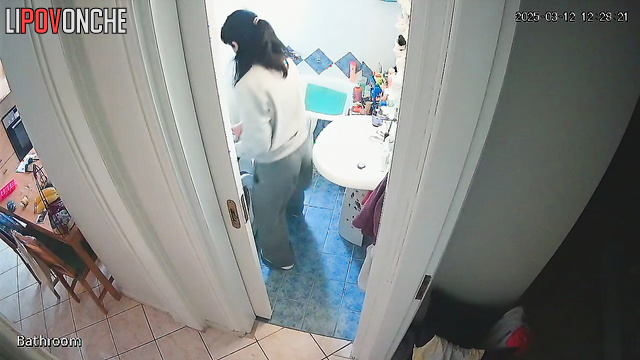 A pretty brunette likes to direct the shower stream at her delicate anus
