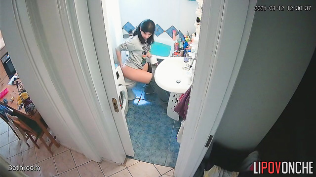A pretty brunette likes to direct the shower stream at her delicate anus