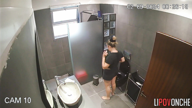 Blonde takes off her shorts completely so she can sit more comfortably on the toilet