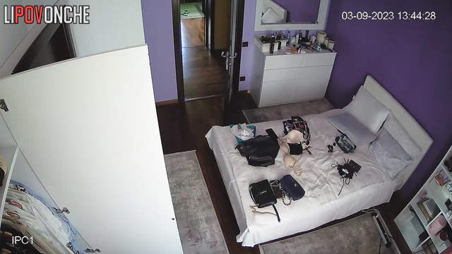 A skinny, naked cutie with a toned butt admires her sexy body in the mirror