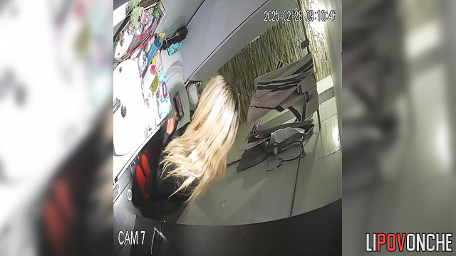 The blonde bares her tattooed butt as she sits down on the toilet