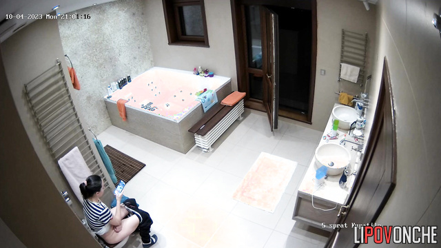 The girl threw the balcony door wide open just before sitting down on the toilet