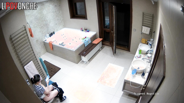 The girl threw the balcony door wide open just before sitting down on the toilet