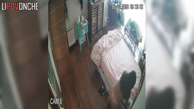 A sexy milf makes her bed, seductively showing off her naked body