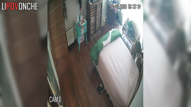 A sexy milf makes her bed, seductively showing off her naked body