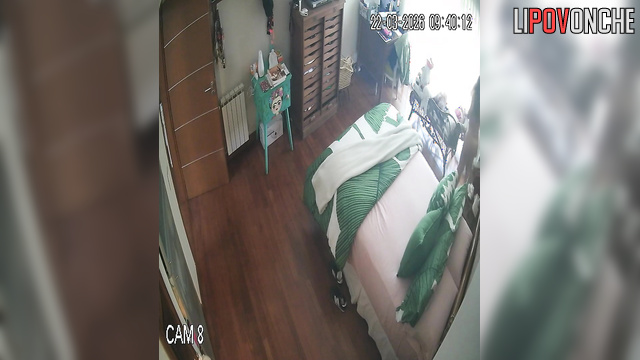 A sexy milf makes her bed, seductively showing off her naked body