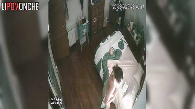 A chubby milf gently caresses her big boobs as she undresses before bed