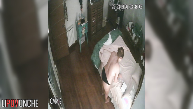 A chubby milf gently caresses her big boobs as she undresses before bed