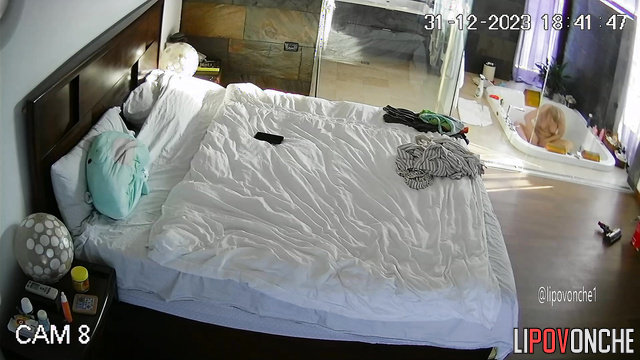 Busty naked blonde doing her morning routine (huge bedroom)