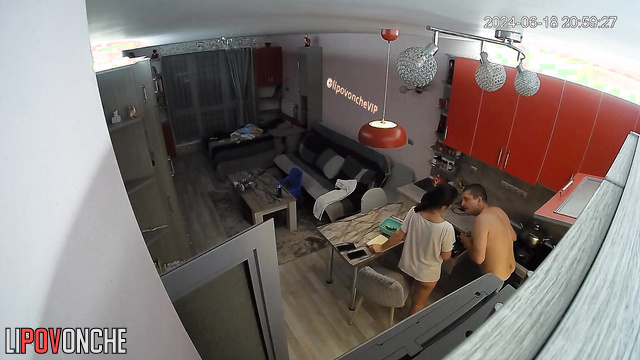 Family preparing for a meal in their huge kitchen