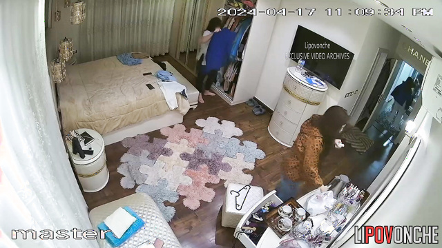 Brunette girls choose outfits for each other in the bedroom