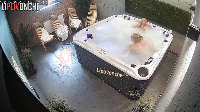 The couple took off their robes and began relaxing in the jacuzzi naked
