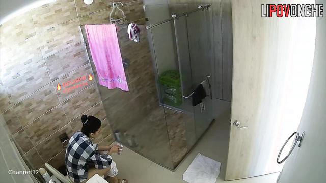 Private hidden camera video in the bathroom of a big-breasted mommy