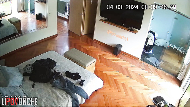 A hidden camera installed in the bedroom captured an attractive naked girl