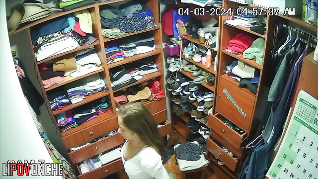A seductive mommy completely strips down in the locker room, unaware of the camera