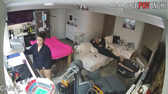 During a massage, a bald man plays with his naked wife's delicate labia