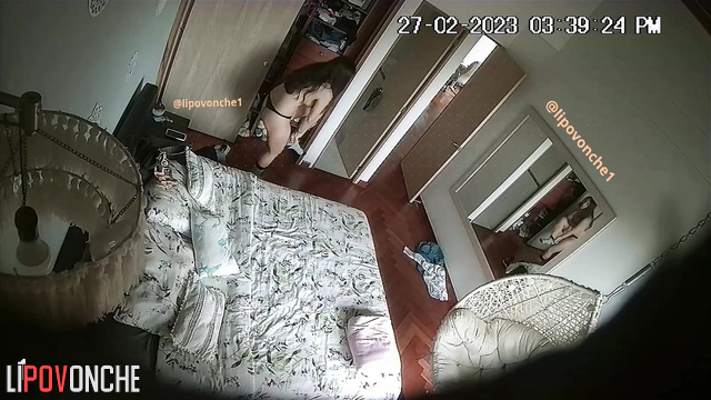 A brunette undresses in front of the mirror before a steamy masturbation session