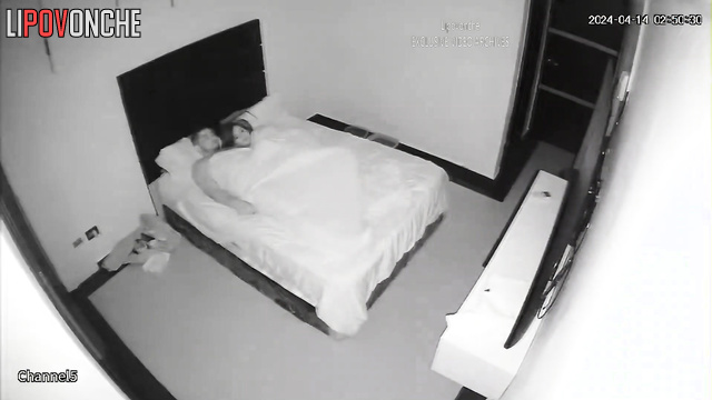 A long-haired brunette takes off her T-shirt while bouncing on her husband's cock
