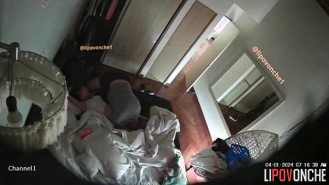 Man caresses brunette on bed in bedroom and gives her cunnilingus