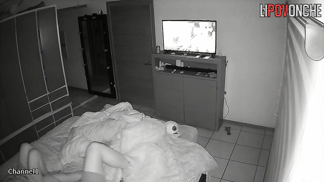 A naked brunette eagerly pulls her husband's T-shirt off while sitting on his cock