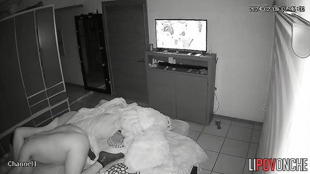 A naked brunette eagerly pulls her husband's T-shirt off while sitting on his cock