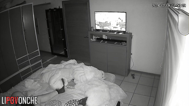 A naked brunette eagerly pulls her husband's T-shirt off while sitting on his cock