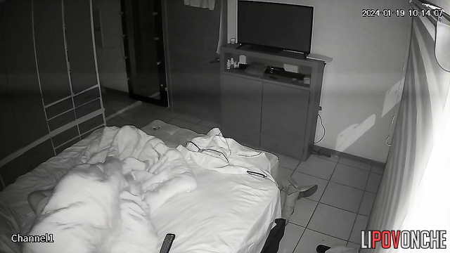 The sly wife crept up under the covers to her husband's erect dick