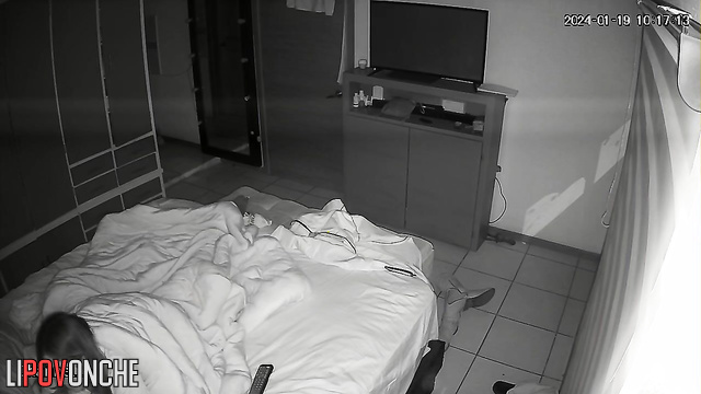 The sly wife crept up under the covers to her husband's erect dick